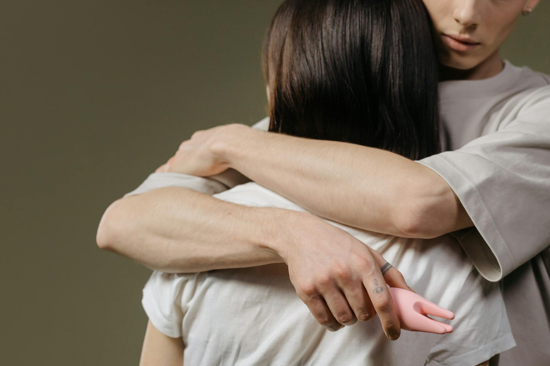 Close-up of a couple embracing, highlighting intimacy and reconnection after trauma.